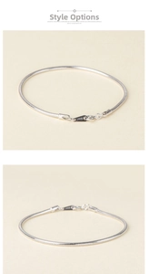 Detail view of S925 sterling silver snake chain bracelet with hallmark on lobster clasp