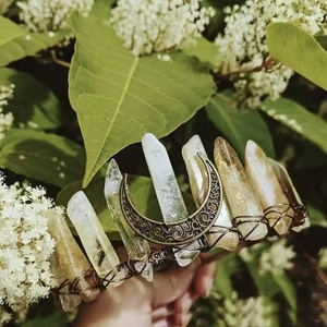Detailed macro view of natural citrine crystal crown with vintage crescent moon ornament