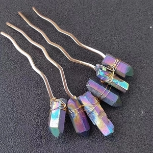 Detail of handmade metal hair comb with six iridescent crystal prisms and wire wrapping