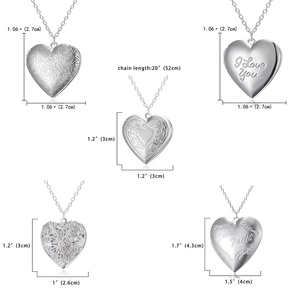 Detail of silver heart locket pendants with engraved text and chain length measurements
