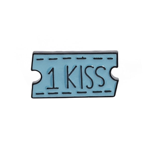 Blue ticket enamel pin featuring 1 KISS text and black border on a white background
