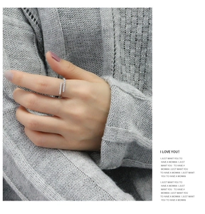 Close-up of minimalist adjustable 925 silver ring with micro-paved cubic zirconia