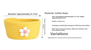 Detail of yellow cotton woven storage basket with white flower and size dimensions