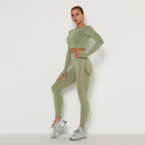 Side view of seamless green yoga set featuring ribbed crop top and high waist leggings