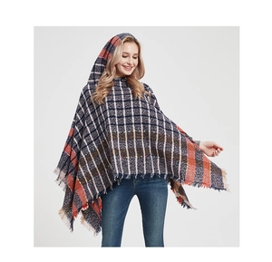 Detail of hooded plaid poncho in navy blue with elegant tassel fringe decoration