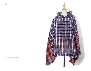 Detail of the hooded plaid shawl with tassel hem in navy blue and orange knit fabric