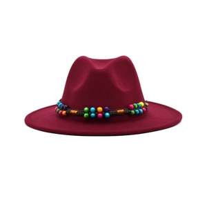 Deep burgundy wool felt fedora hat featuring a colorful ethnic beaded decorative band