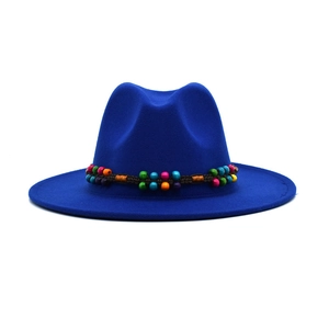Close-up of royal blue wool fedora featuring a colorful ethnic beaded decorative band