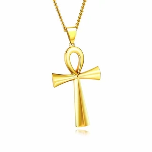 Detailed view of a polished gold Ankh cross pendant with reflective metal finish