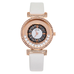 Detail of rose gold quartz watch with double diamond bezel and rolling dial crystals