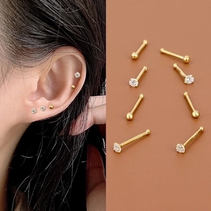 Detailed close-up of S925 silver gold-plated ginkgo leaf earrings with zircon inlay