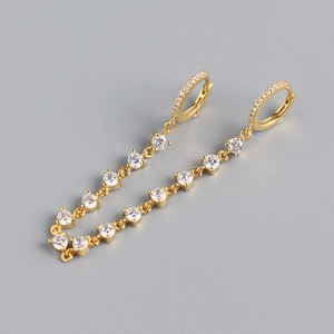 Detail of luxury S925 sterling silver long tassel earrings with sparkling white zircons