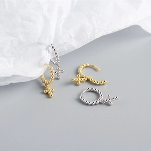 Detailed view of S925 sterling silver hoop earrings with bead cross charms in gold and silver
