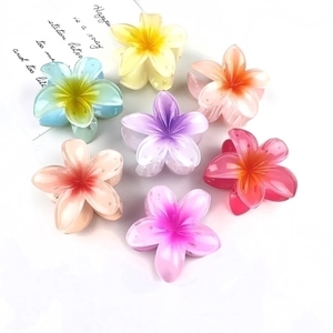 Set of seven colorful translucent plumeria flower hair claws in candy colors for women