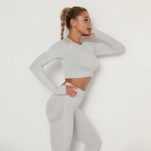 Detailed view of seamless yoga set featuring light grey knit texture and breathable mesh fabric