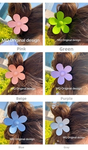 Collage of six matte flower hair claws in macaron colors shown on female hair