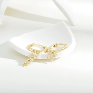 Elegant gold asymmetrical earrings set with micro-pave zircon butterfly and bar pendants
