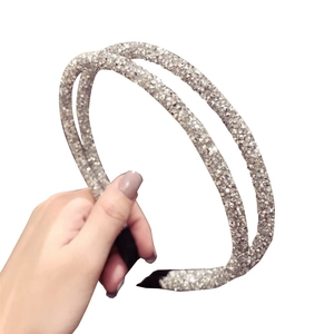 Double-layered silver rhinestone headband for women featuring a shimmering crystal finish