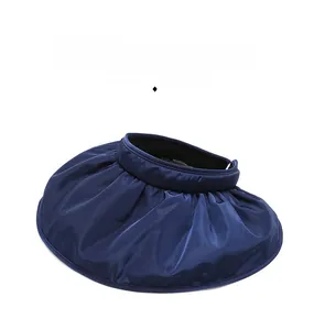 Detailed top view of wide brim navy sun hat with glossy fabric and wavy edge texture
