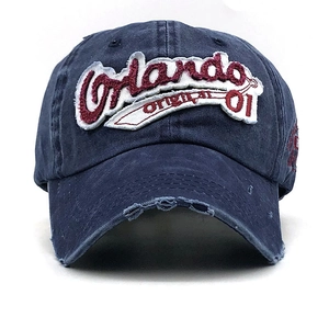Distressed navy blue cotton baseball cap with Orlando embroidery and vintage finish