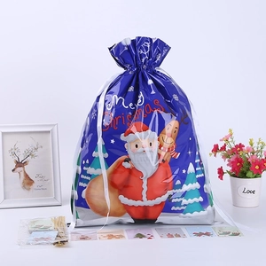 Blue Christmas drawstring gift bag with Santa and reindeer cartoon patterns