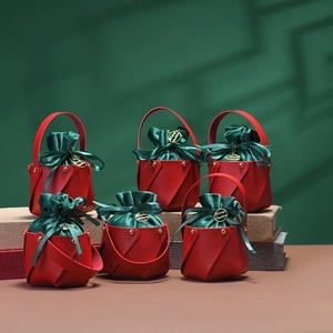 Christmas leather apple gift bags with red PU exterior and green velvet drawstring
