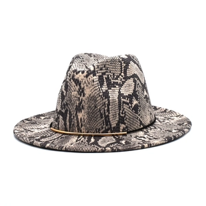 Detail of snake skin pattern wool fedora with a decorative gold metal trim band