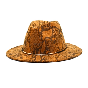 Close-up of snakeskin pattern fedora with black ribbon and gold metal detail
