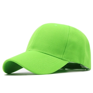Detail of neon green cotton twill baseball cap with curved brim and ventilation holes