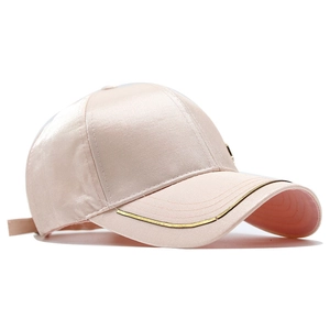 Pink satin baseball cap with metallic trim brim and glossy finish, 45-degree angle view