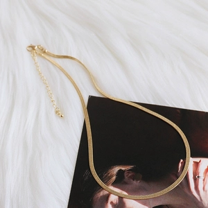 Elegant gold flat snake bone chain necklace for women with minimalist stainless steel link