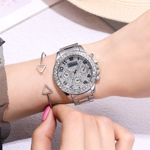 Silver Geneva watch set with rhinestone embellishments and geometric triangle bracelet