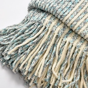 Chenille knit poncho shawl with boat neck, tassels, and tri-color blue grey pattern