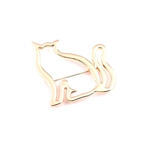 Polished gold hollow cat brooch minimalist fashion accessory on white background