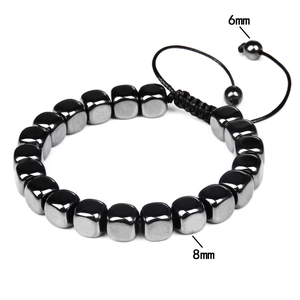 Macro detail of 8mm hematite stone beads with adjustable woven cord and 6mm accents