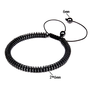 Detail view of 2x6mm hematite stone beads with adjustable drawstring closure mechanism