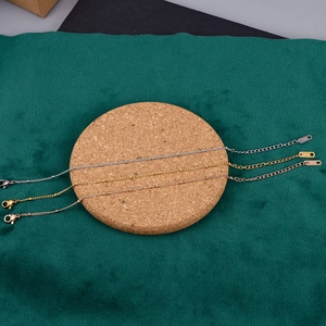 Three minimalist 18K gold bean chains in silver, gold, and rose gold with K18 tags