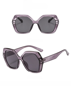 Detailed view of polygon oversized sunglasses with purple frame and dark grey lenses