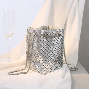 Elegant silver metallic mesh bucket bag with shimmering rhinestones and chain strap