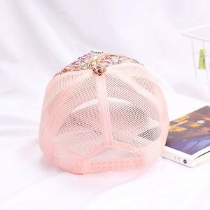 Pink sequin mesh baseball cap with adjustable buckle on a soft white background