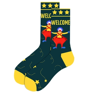 Detail of dark green mid-calf crew socks with yellow accents and colorful clown pattern