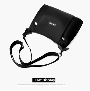Detail of high-density waterproof oxford fabric and silver metal zipper on black crossbody bag