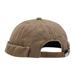 Vintage khaki washed canvas docker cap with adjustable metal strap on white background