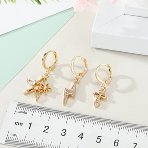 Golden hoop earring set with mini star lightning and cross zircon charms