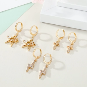 Three pairs of gold-plated hoop earrings with star, cross, and lightning zircon charms