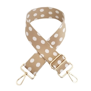 Close-up of adjustable khaki polka dot wide strap with golden metal lobster clasps