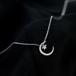 Elegant 925 silver crescent moon and star pendant necklace with cubic zirconia on black mesh