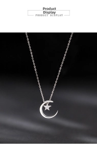 Detail of 925 silver crescent moon necklace with a zircon-encrusted star pendant