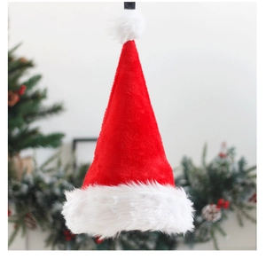 Detailed view of a plush red Christmas hat with thick white trim on a festive background
