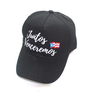 Detail of black baseball cap featuring white Juntos Venceremos text and Puerto Rico flag